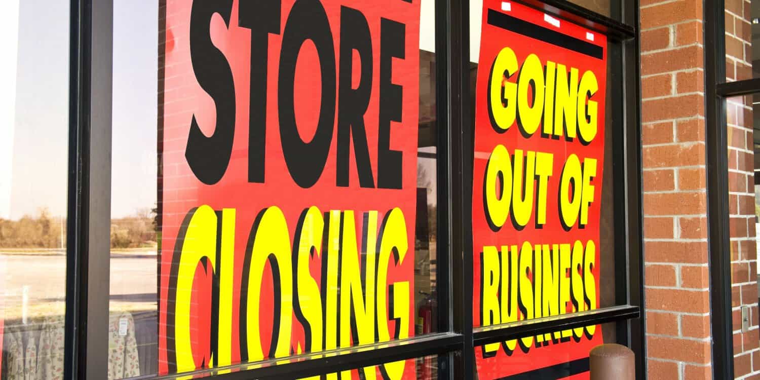 A shopfront with signs up saying 'Store Closing' and 'Going Out of Business'.